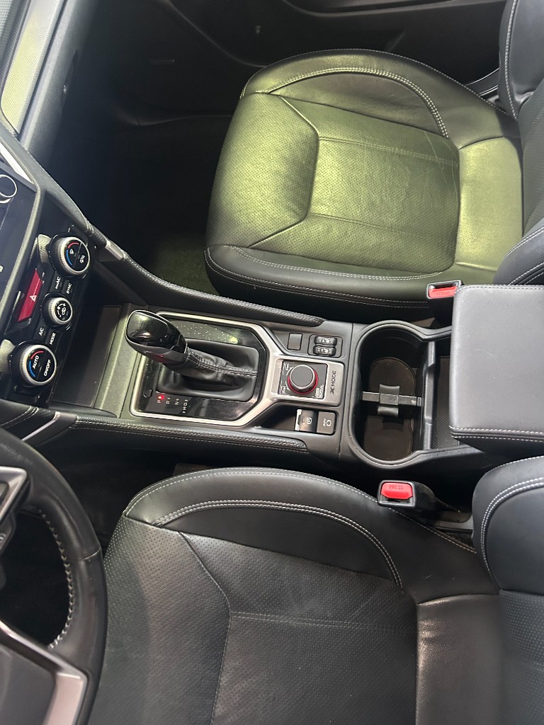 Clean Subaru console and perforated leather seats