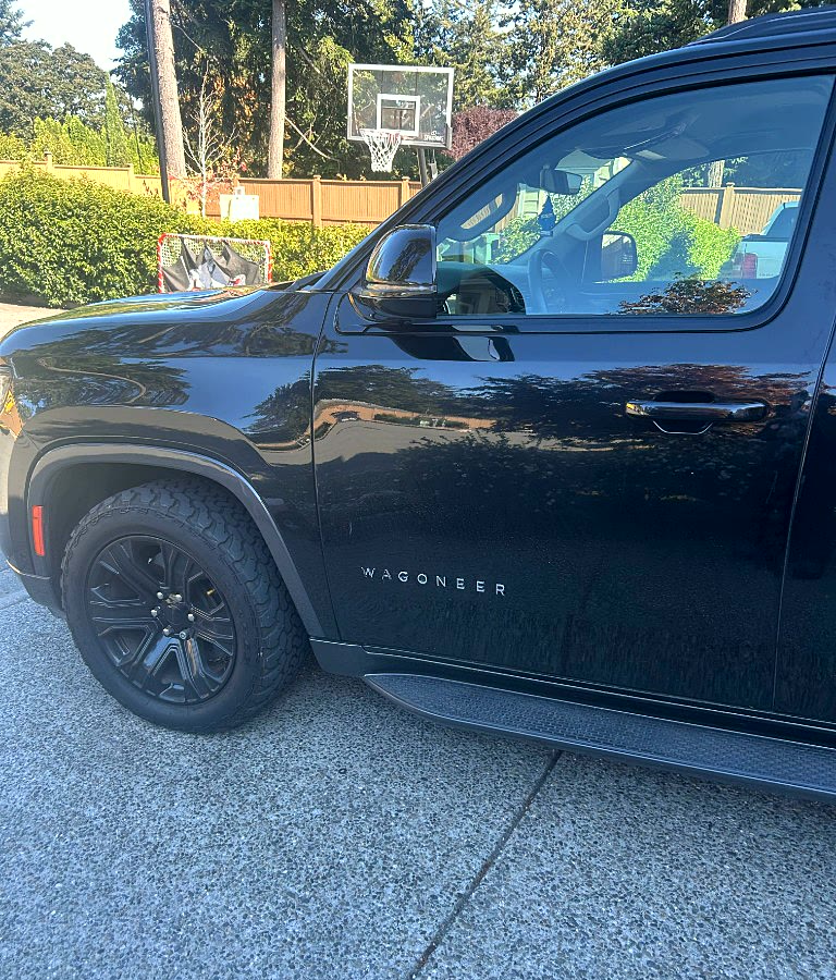 Glossy black Wagoneer door and wheel