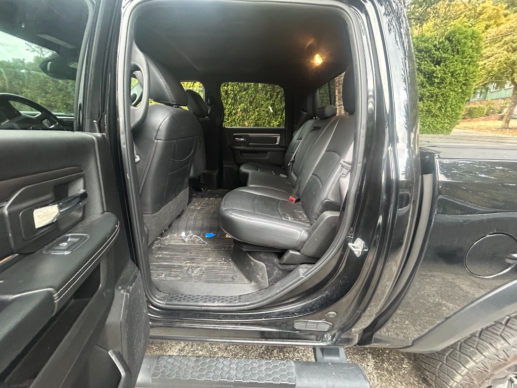 Before — dirty pickup truck rear seats and floor with mud and crumbs